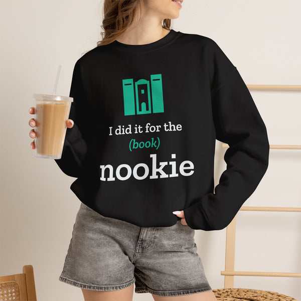 Woman wearing the black Nook & Things bookish crewneck sweatshirt with an iced coffee