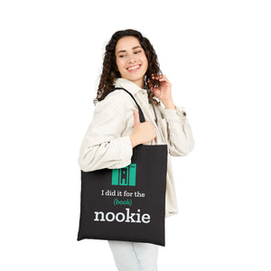 Woman carrying the black bookish tote bag by the handles