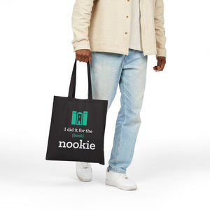 Black canvas book tote carried at the side, hanging from the 20 inch handles