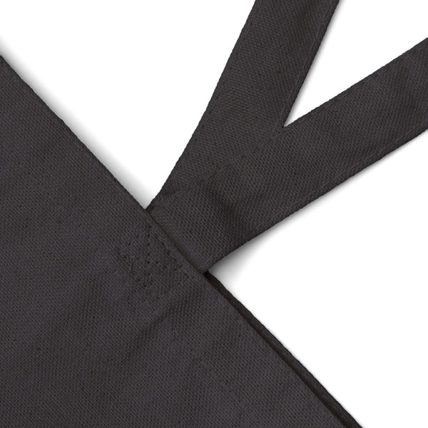 Close up of the black 12 oz cotton canvas and the handle seam