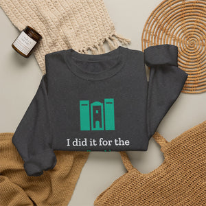 Dark heather grey Nook & Things crewneck sweatshirt styled flat with a blanket and candle