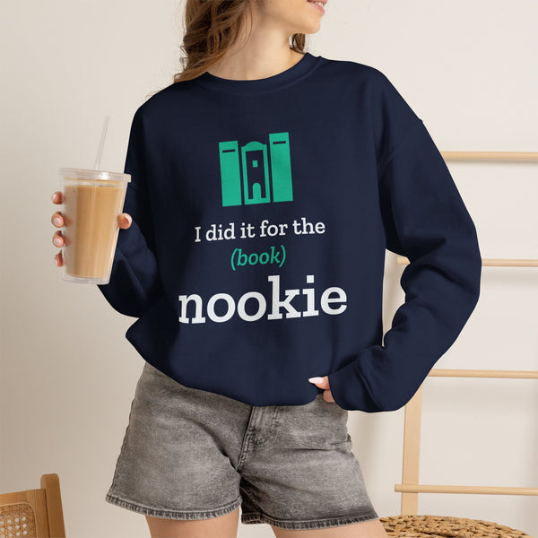 Woman wearing the navy Nook & Things bookish crewneck sweatshirt with an iced coffee