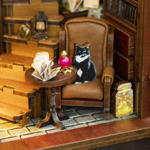 Nook & Things Magic Coffee House DIY book nook kit, close-up of the cat on the armchair