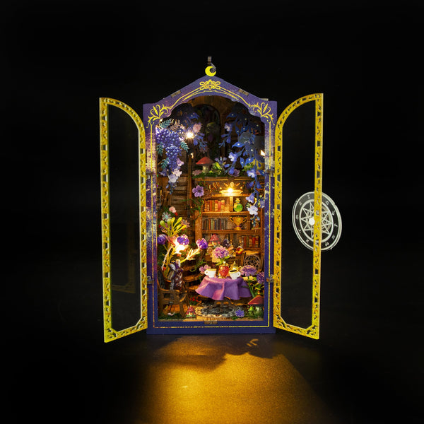 Nook & Things Magic Garden Workshop DIY miniature kit, lit up on a dark background