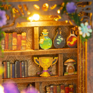 Nook & Things Magic Garden Workshop DIY miniature kit, close-up of the potion shelf and trophy
