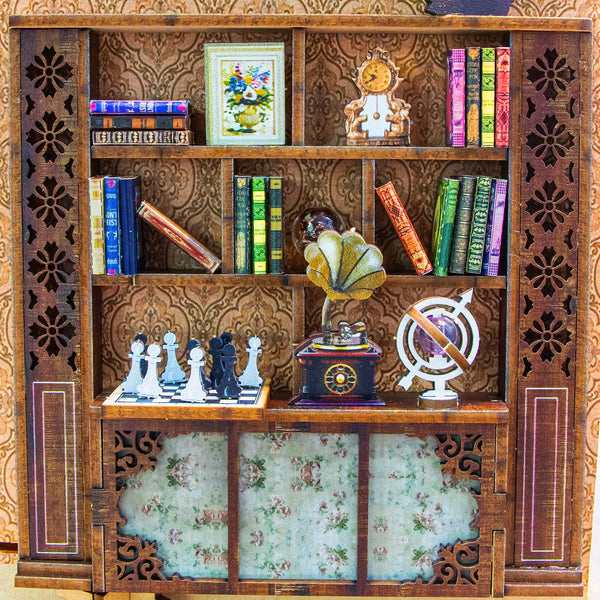 Nook & Things Magical Library DIY book nook kit, close-up of the miniature bookshelf and globe