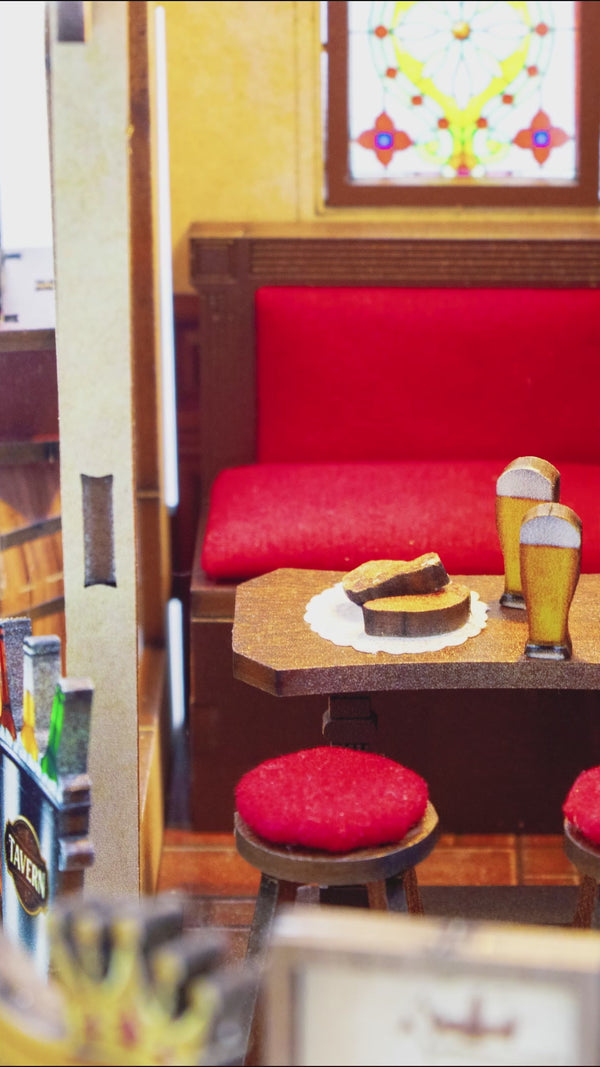 Nook & Things Crown Tavern miniature kit, finished pub interior with a red booth and bar stools