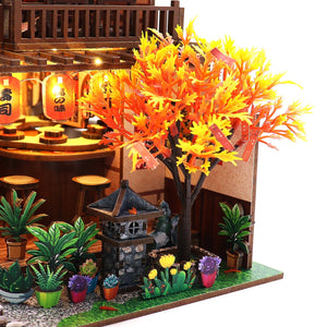 Nook & Things Wawei Sushi House DIY miniature kit, close-up of the maple tree and stone lantern